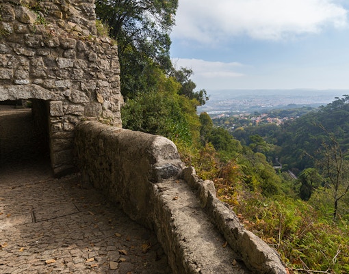 Door of Betrayal in Moorish Castle with scenic view of Sintra landscape.