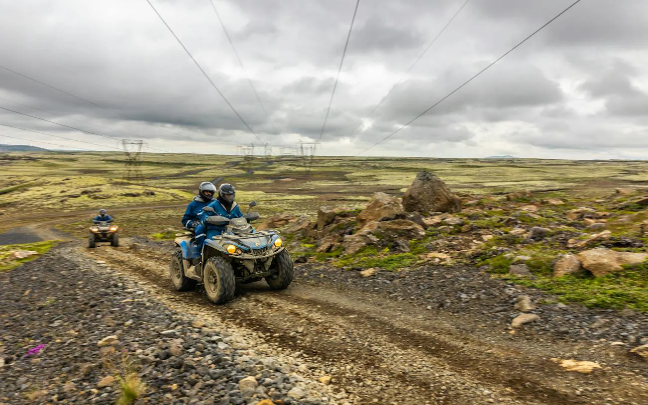 ATVs on rocky trail during Twin Peaks tour with mountain views, Reykjavik.