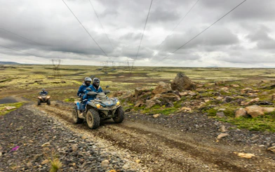 ATVs on rocky trail during Twin Peaks tour with mountain views, Reykjavik.