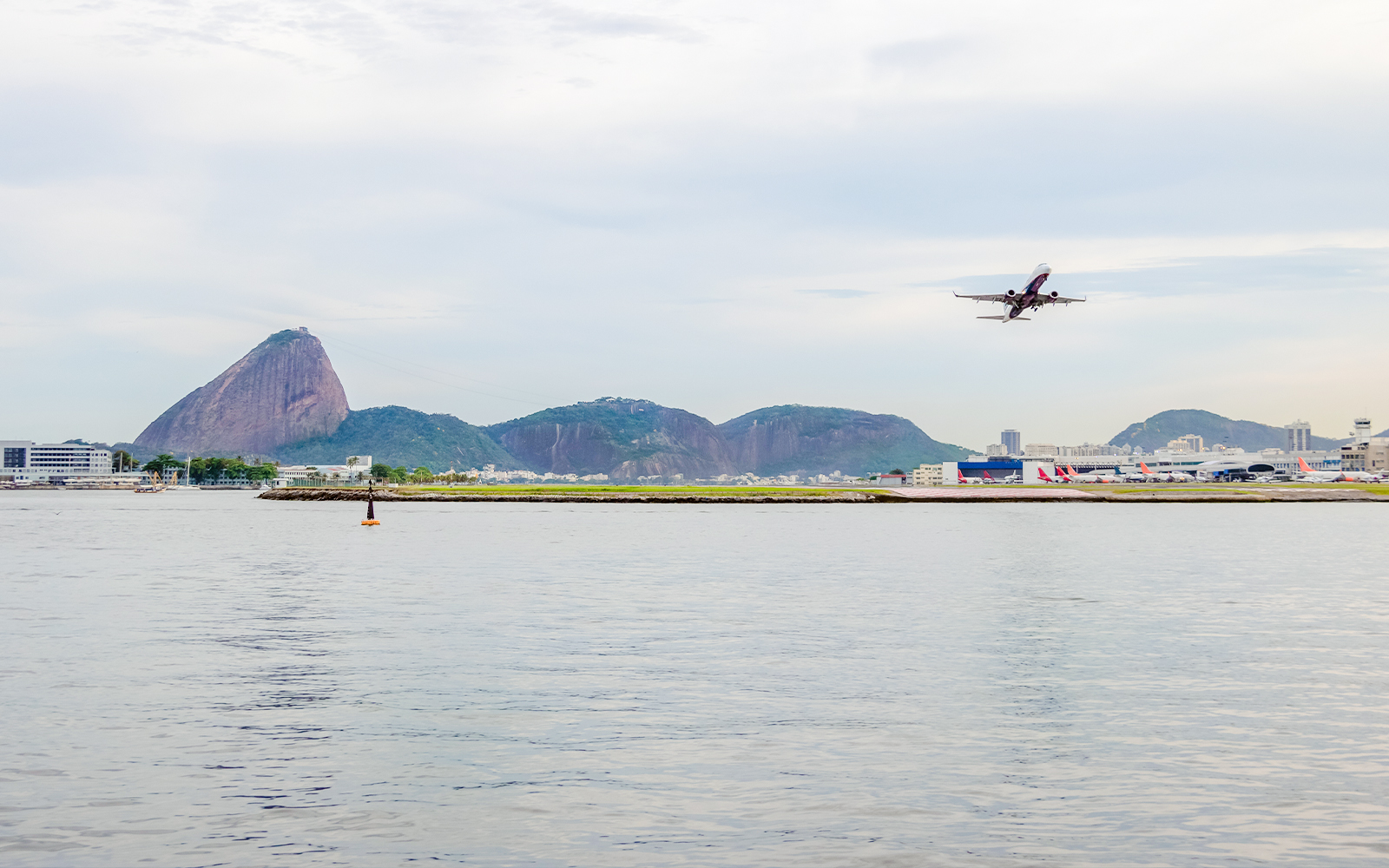 Speedboat view of Santos Dumont Airport and Fiscal Island, Rio de Janeiro.