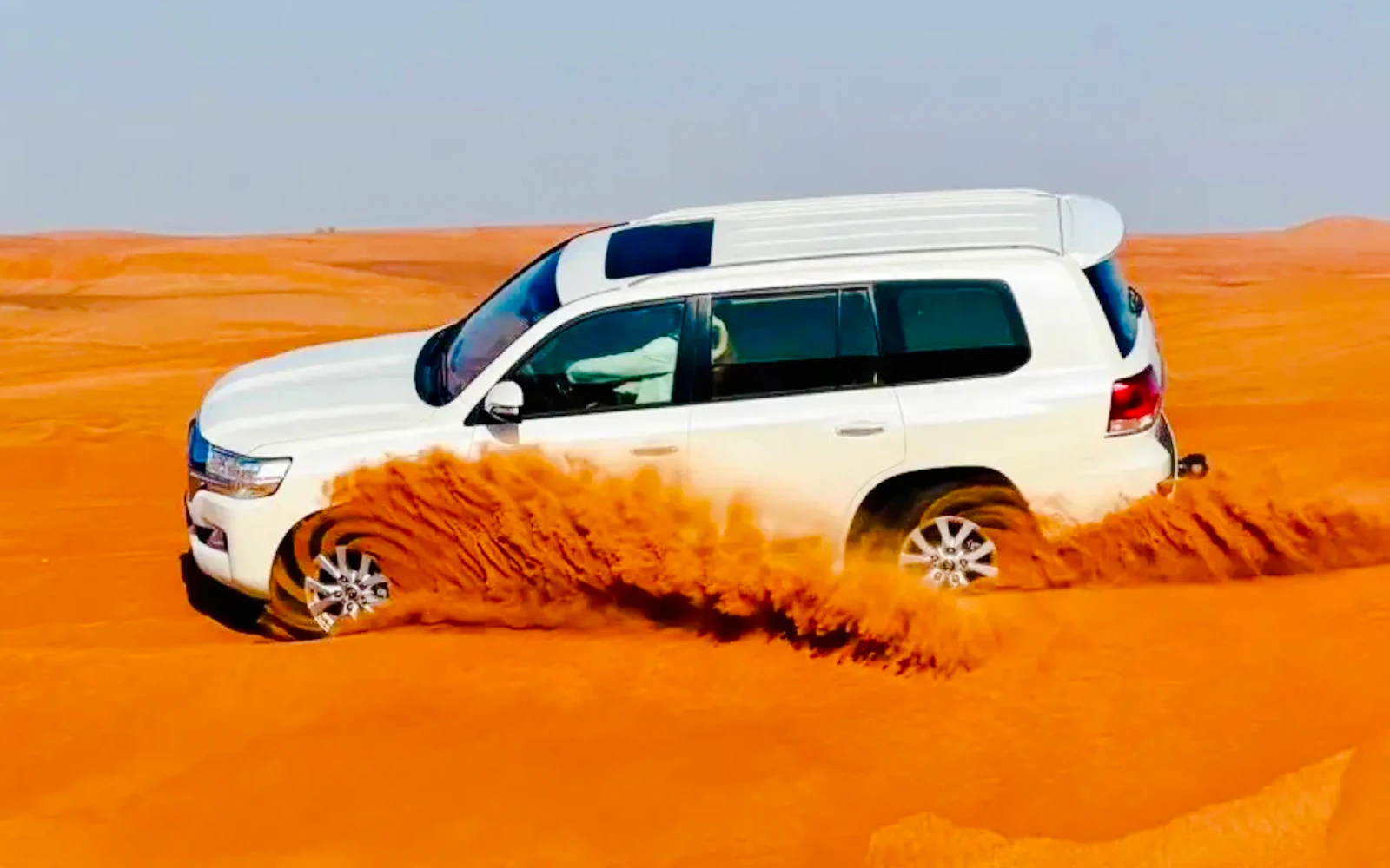 Dubai Evening Desert Safari with 4x4 Dune Bashing, BBQ Dinner, Live Shows & Hotel Transfers Image 1