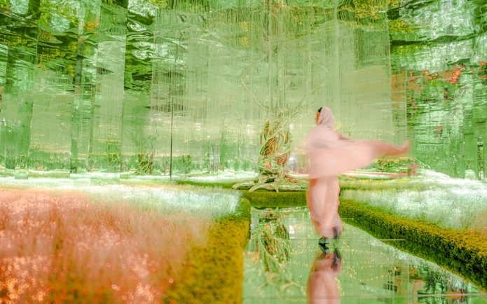 Visitor exploring the vibrant Flora zone at AYA Universe, Dubai.