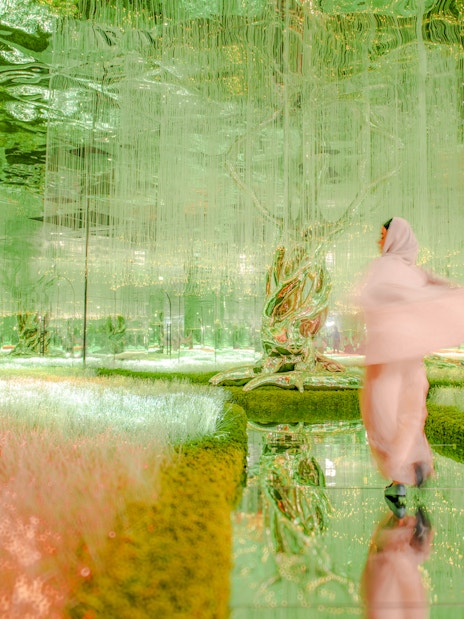 Visitor exploring the vibrant Flora zone at AYA Universe, Dubai.