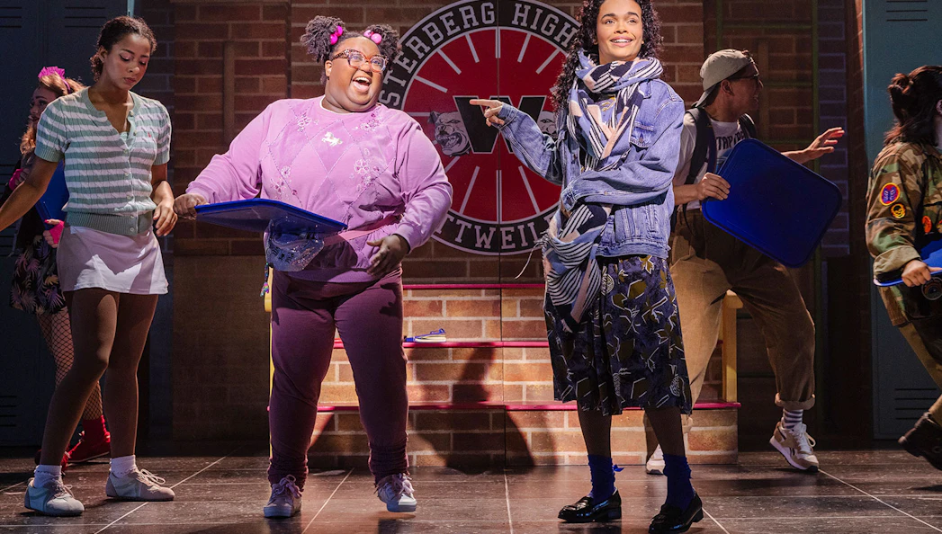Cast performing a scene from Heathers: The Musical on stage at Westerberg High.