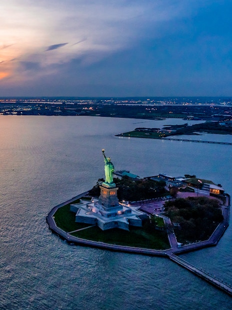 Statue of Liberty at sunset, view from private NYC tour from Westchester.