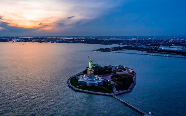 Statue of Liberty at sunset, view from private NYC tour from Westchester.