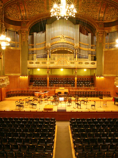Vienna concert hall interior with stage and seating for classical music events.
