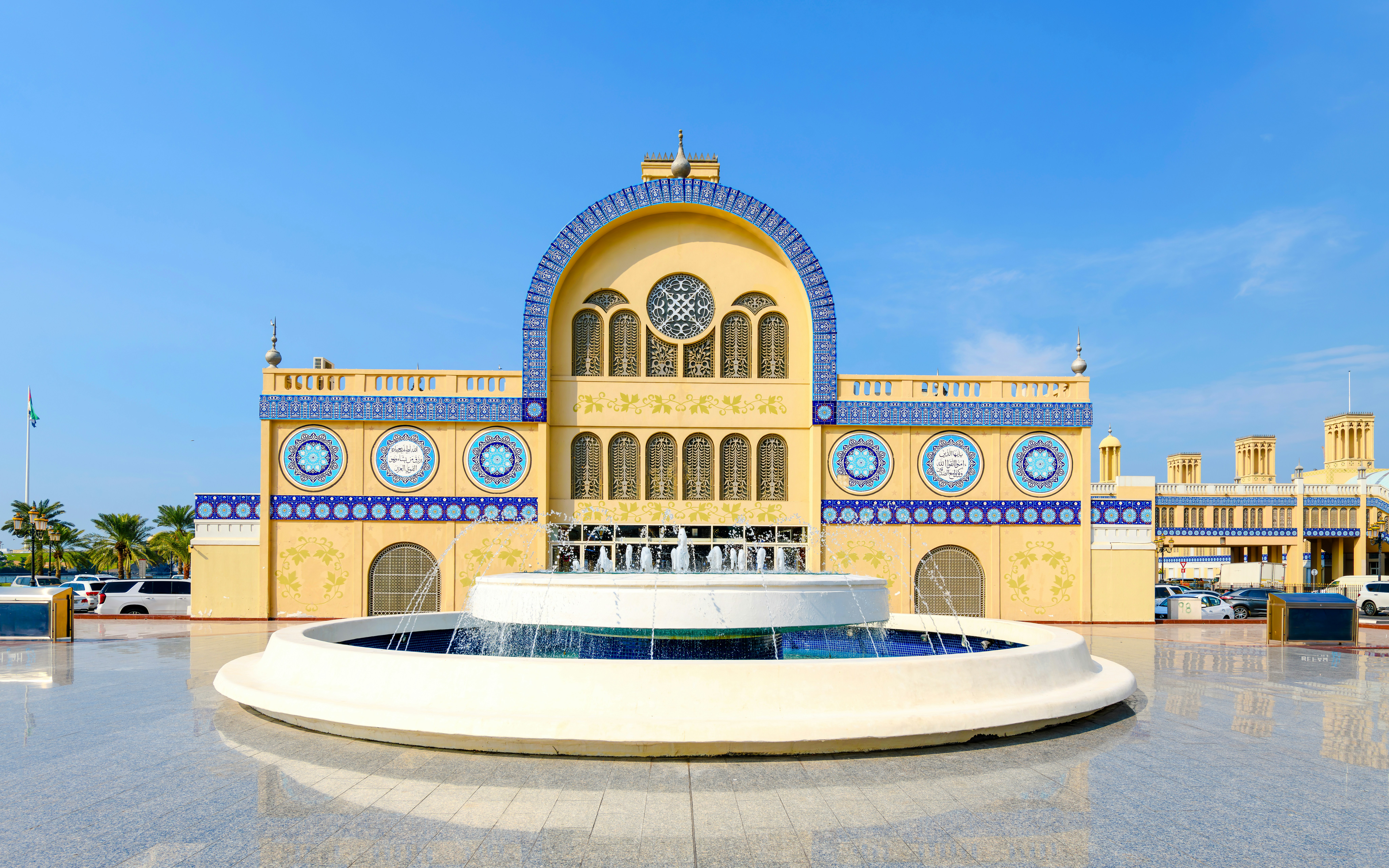 Central Blue Souk in Sharjah with ornate blue tile facade and central fountain.