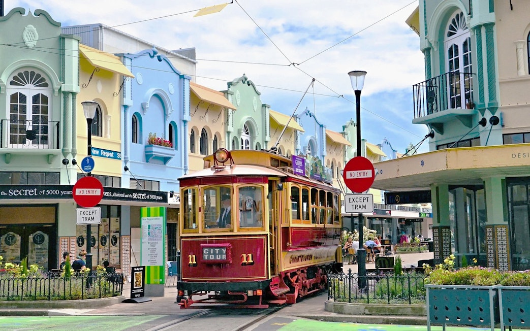 Christchurch tram on New Regent Street with colorful buildings in the background.