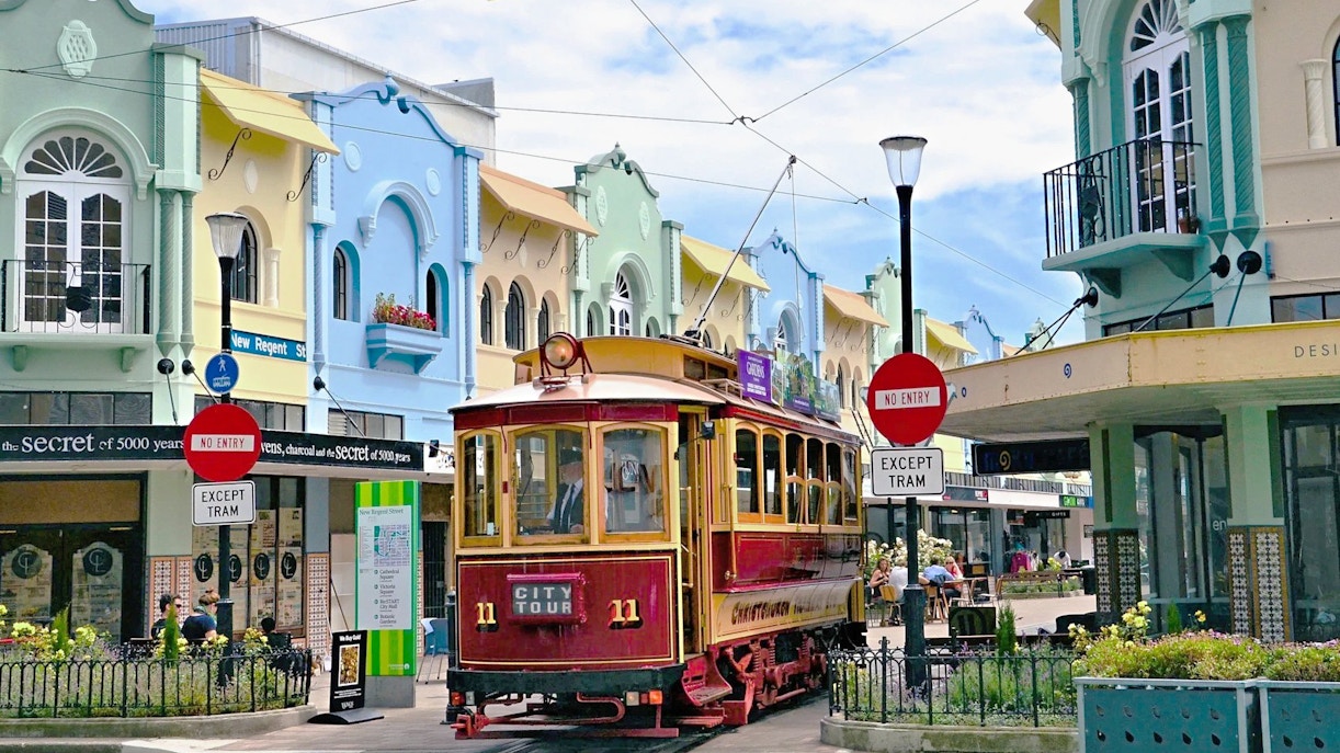 Christchurch tram on New Regent Street with colorful buildings in the background.