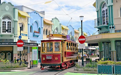 Christchurch tram on New Regent Street with colorful buildings in the background.
