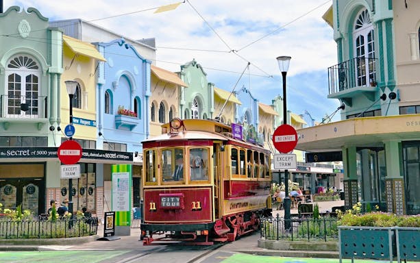Christchurch tram on New Regent Street with colorful buildings in the background.