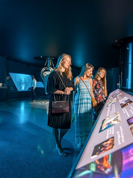 Visitors exploring interactive displays at The View At The Palm, Dubai.