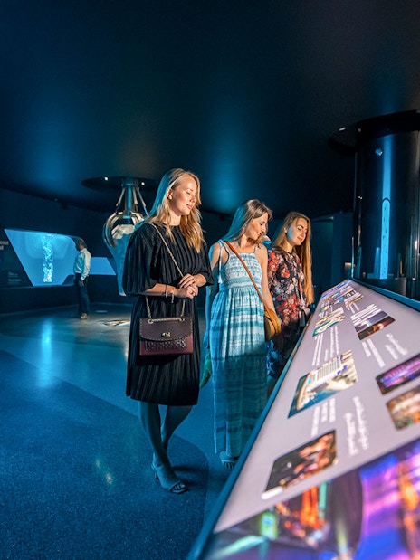 Visitors exploring interactive displays at The View At The Palm, Dubai.