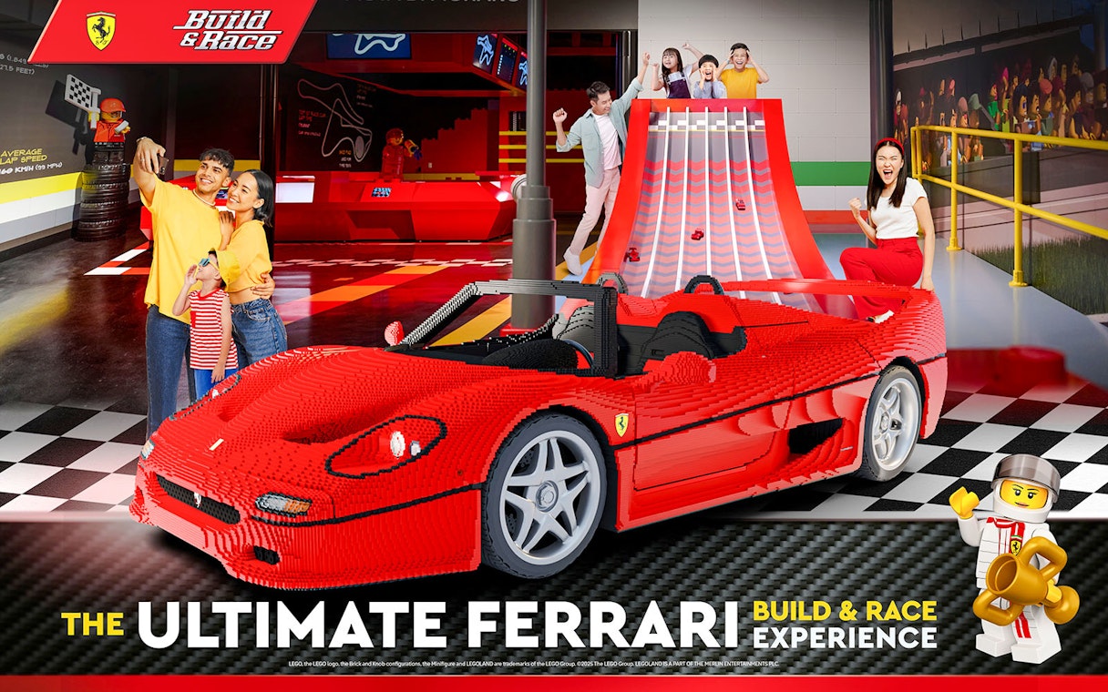 Lego Ferrari car at Legoland's Build and Race experience with families enjoying activities.