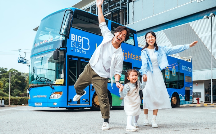 Family enjoying in front of BigBus on Lantau Island Hop-On Hop-Off Sightseeing Tour.