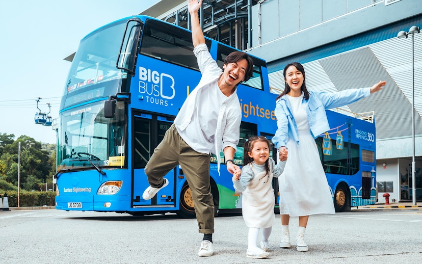Family enjoying in front of BigBus on Lantau Island Hop-On Hop-Off Sightseeing Tour.