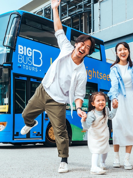 Family enjoying in front of BigBus on Lantau Island Hop-On Hop-Off Sightseeing Tour.