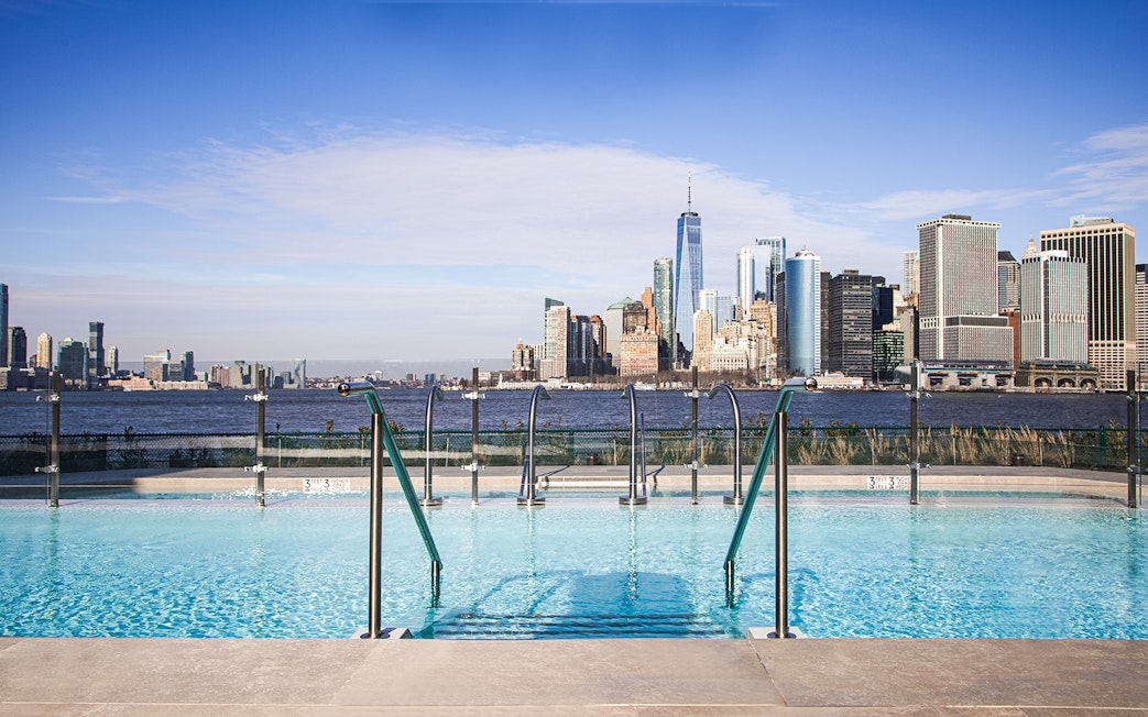 Rooftop pool with New York City skyline view, QC New York.