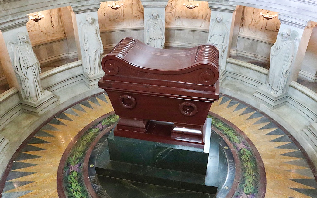 Napoleon's Tomb at Les Invalides, Paris, with ornate sarcophagus and surrounding statues.