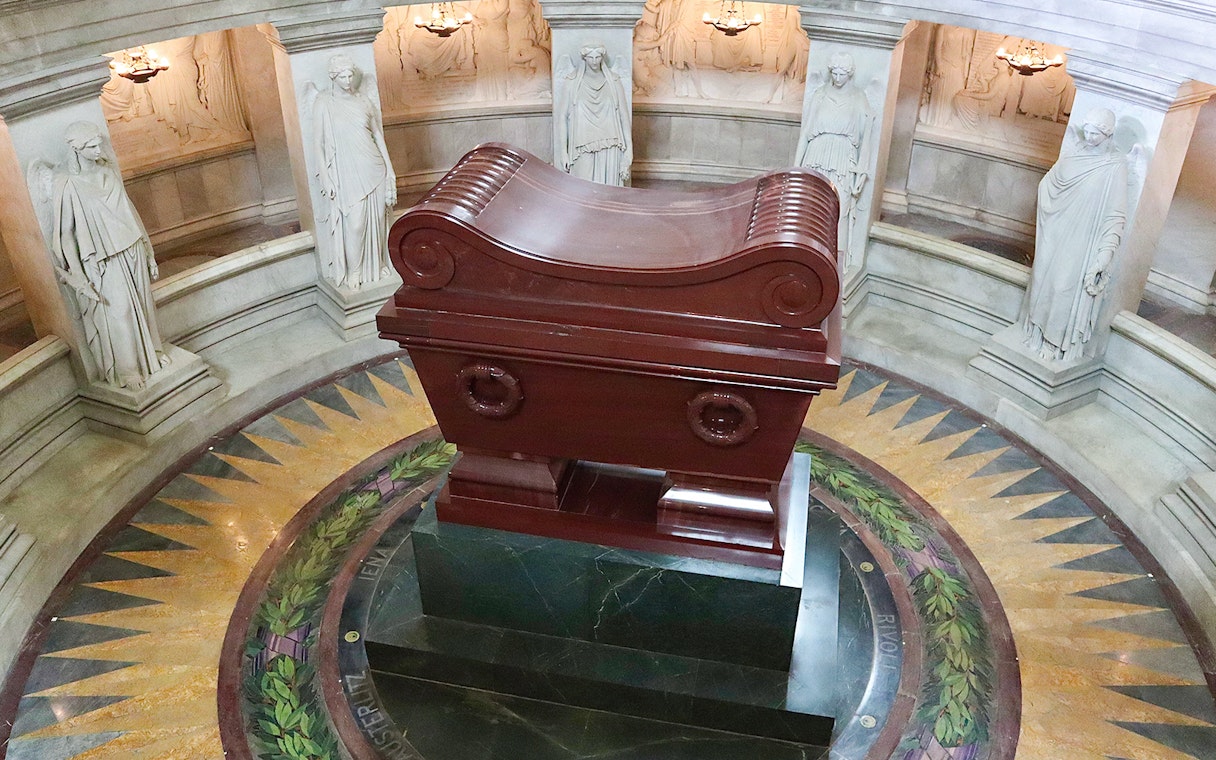 Napoleon's Tomb at Les Invalides, Paris, with ornate sarcophagus and surrounding statues.