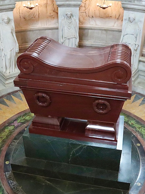 Napoleon's Tomb at Les Invalides, Paris, with ornate sarcophagus and surrounding statues.