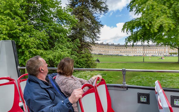Open-top bus view of Royal Crescent, Bath, during hop-on hop-off tour.