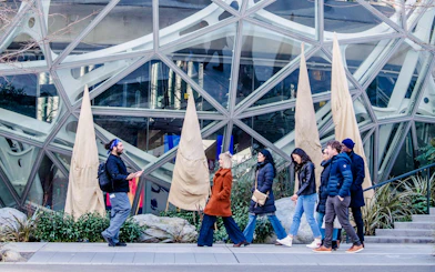 Group walking tour in front of modern architecture in South Lake Union.
