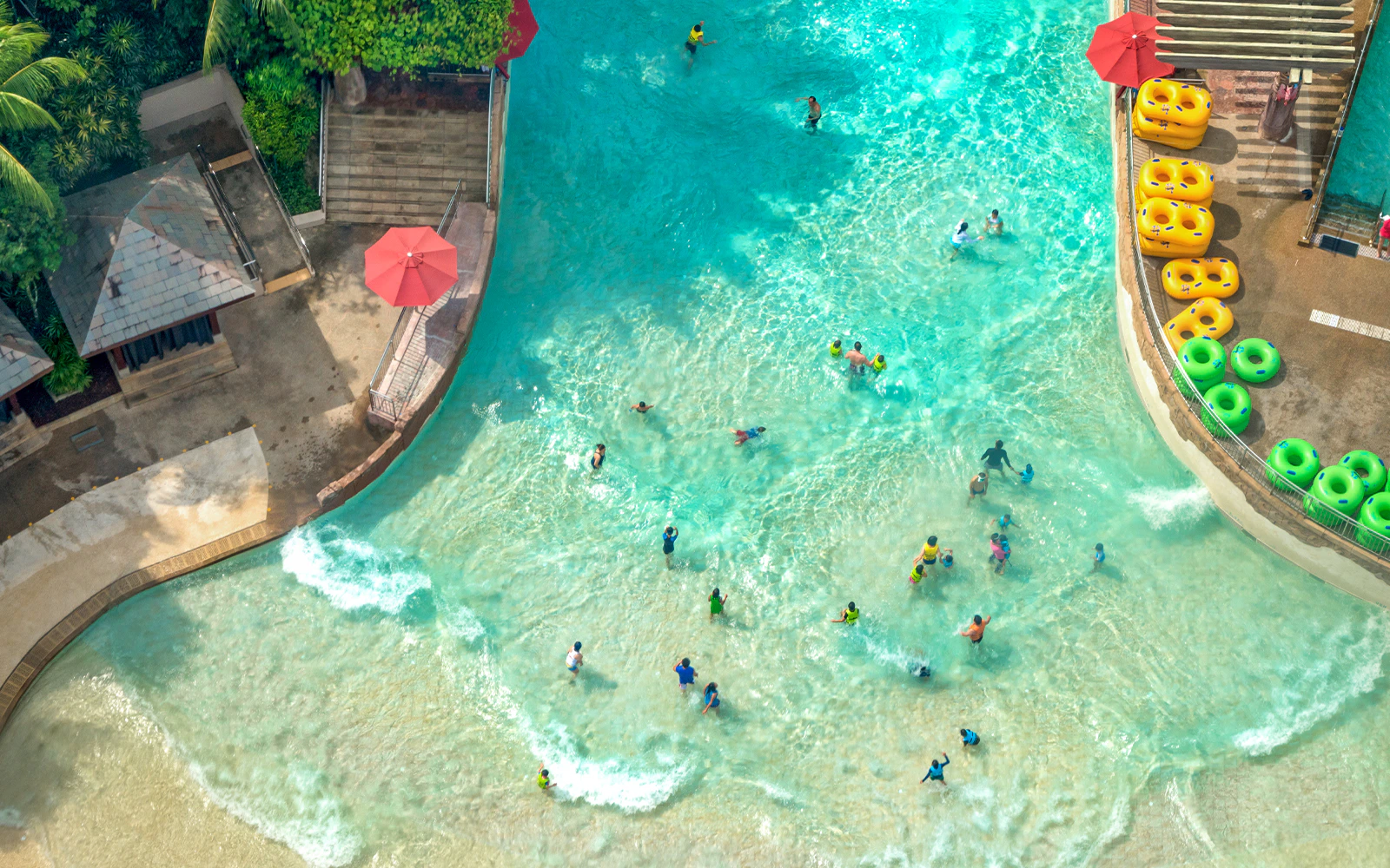 Visitors enjoying the wave pool at Aqualava Water Park, Playa Blanca.