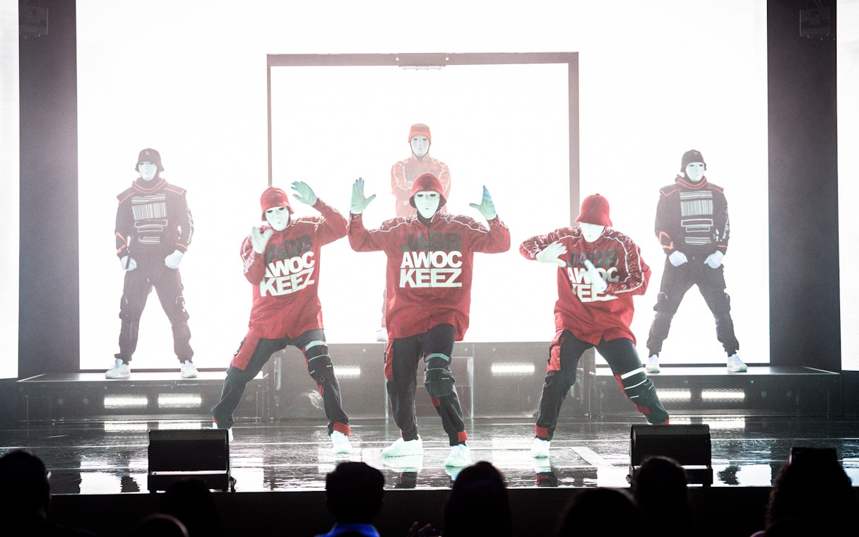 Jabbawockeez dancers performing on stage in Vegas show.