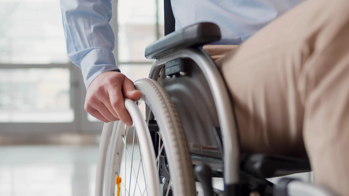 Wheelchair user at Bridge Theatre, London, highlighting accessible seating.