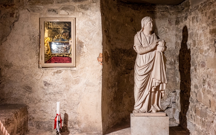 Crypt of Santa Reparata statue and relic display at Florence Cathedral.