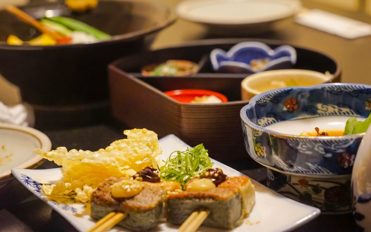 Traditional Japanese dishes on a Kyoto night foodie tour.