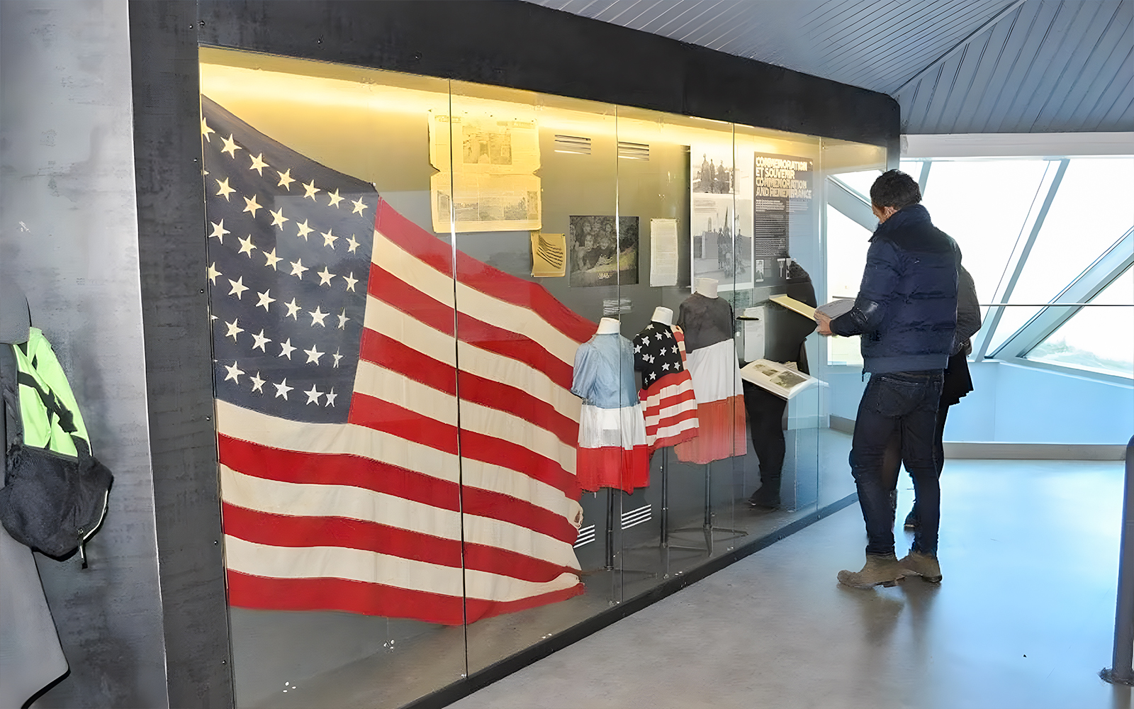 American flag display at Normandy museum exhibit, part of D-Day guided tour from Paris.