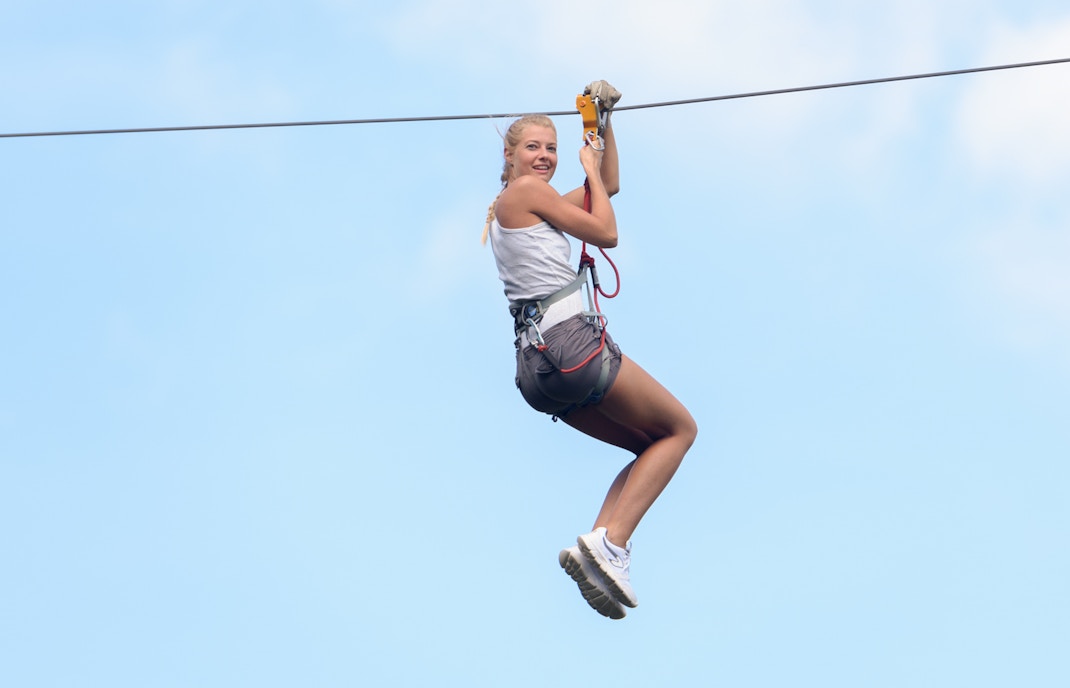 A woman flying LINQ Zipline in Las Vegas