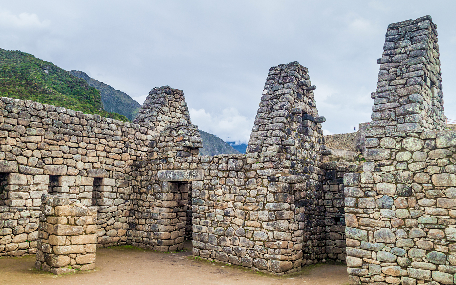 Stone structure with three doorways at Machu Picchu, Peru.