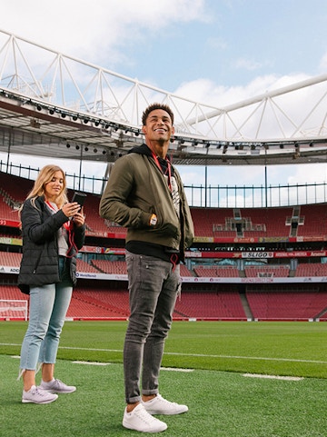 Visitors exploring Emirates Stadium in London.