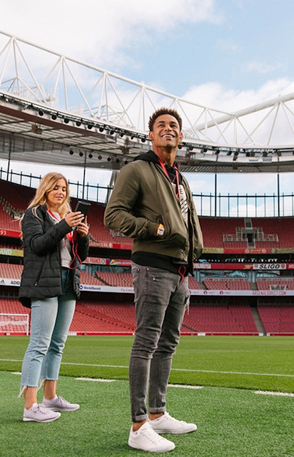 Visitors exploring Emirates Stadium in London.