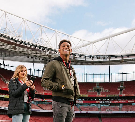 Visitors exploring Emirates Stadium in London.