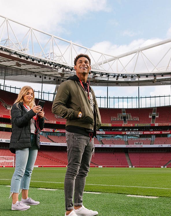 Visitors exploring Emirates Stadium in London.