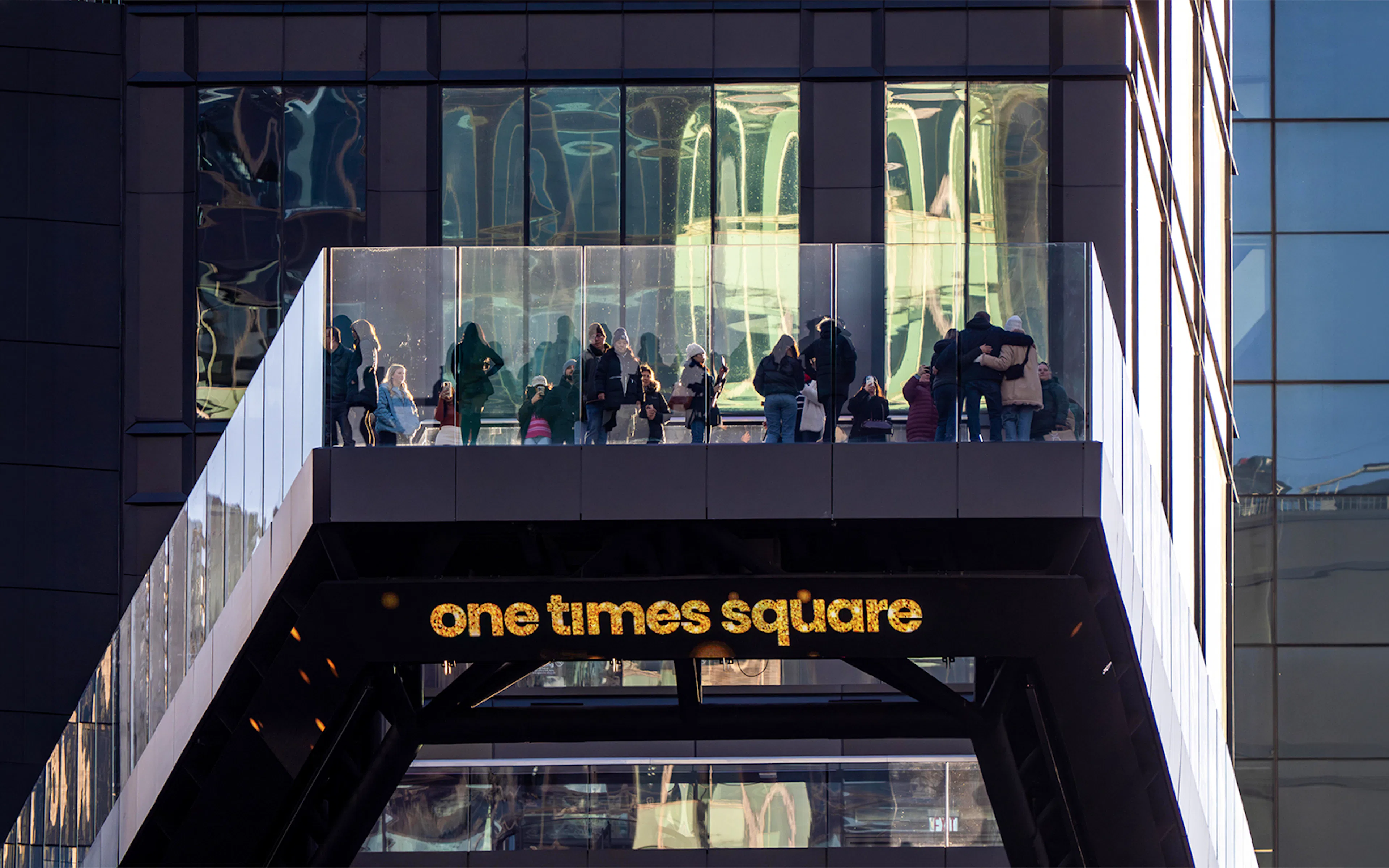 Visitors on the One Times Square Skywalk in New York City.