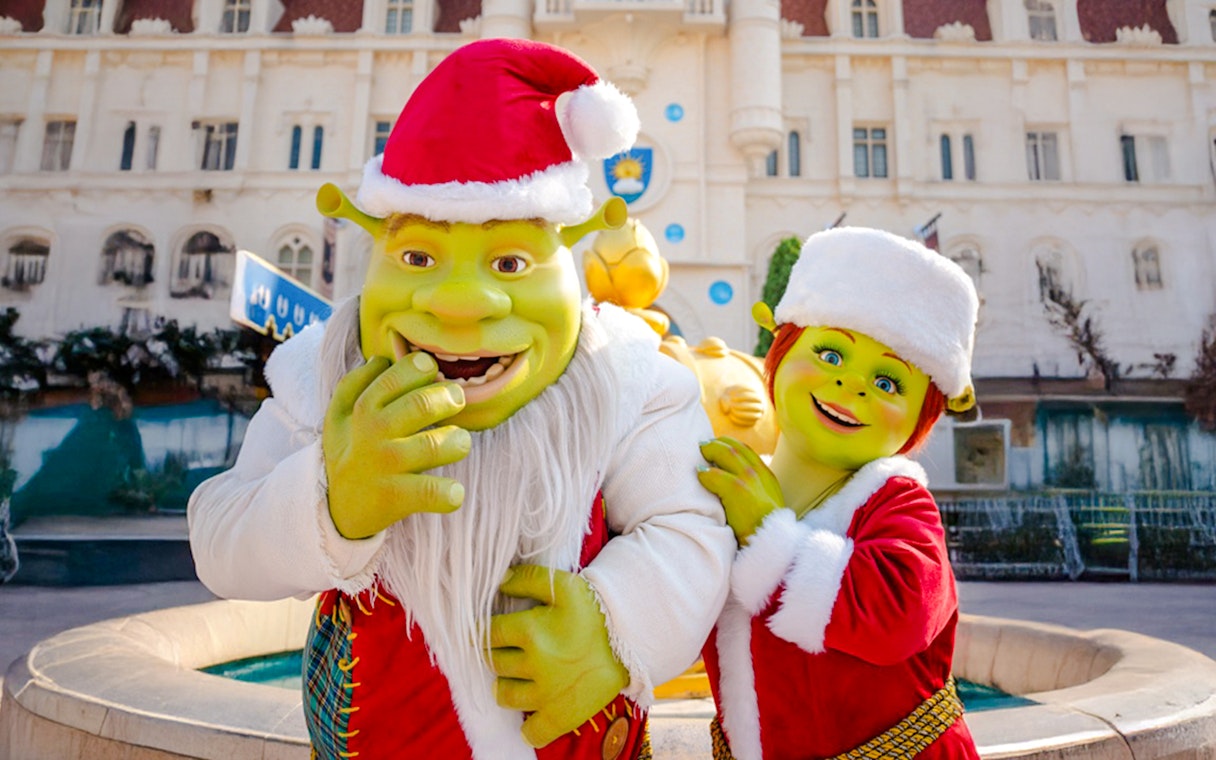 Shrek and Fiona in Christmas outfits at Universal Studios Singapore.