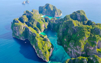 Aerial view of Phi Phi Islands' limestone cliffs and turquoise waters, Krabi day trip destination.