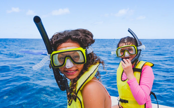 Snorkelers on Kaula Kai Snorkel Sail, Oahu, enjoying ocean views.
