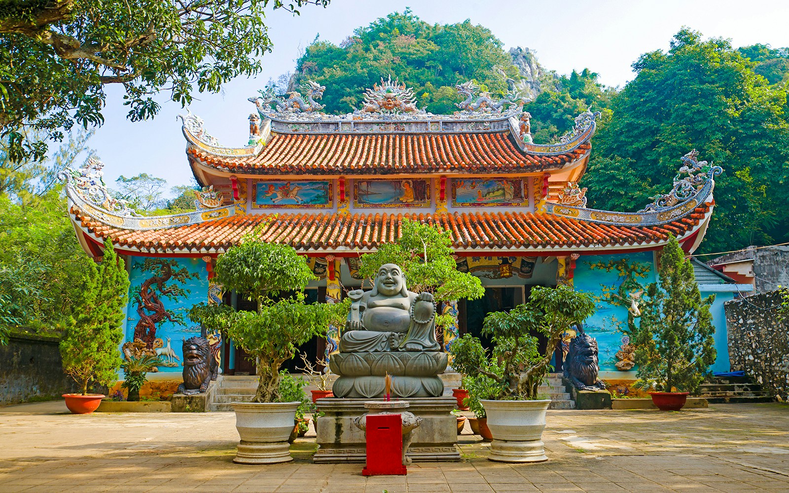 Tam Thai Pagoda with Buddha statue and ornate roof, Da Nang, Vietnam.