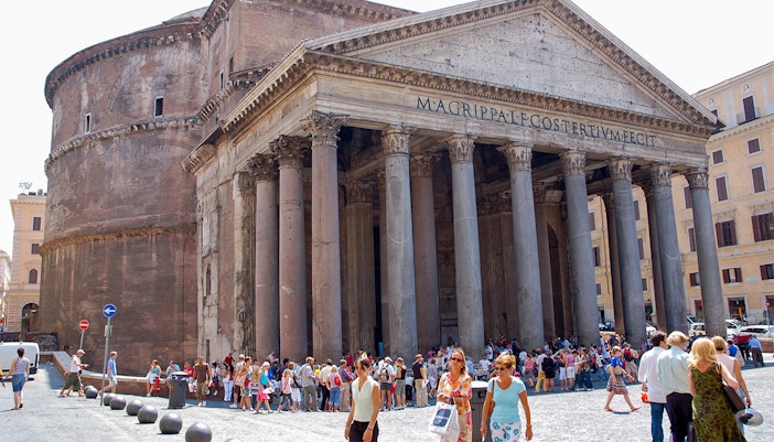 Visitors exploring the interior of the Roman Pantheon in Rome, Italy.