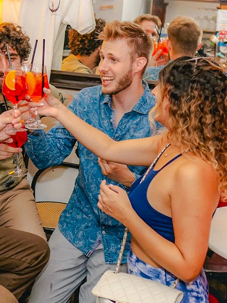 Group enjoying drinks on a Tipsy Tour in Rome bar.