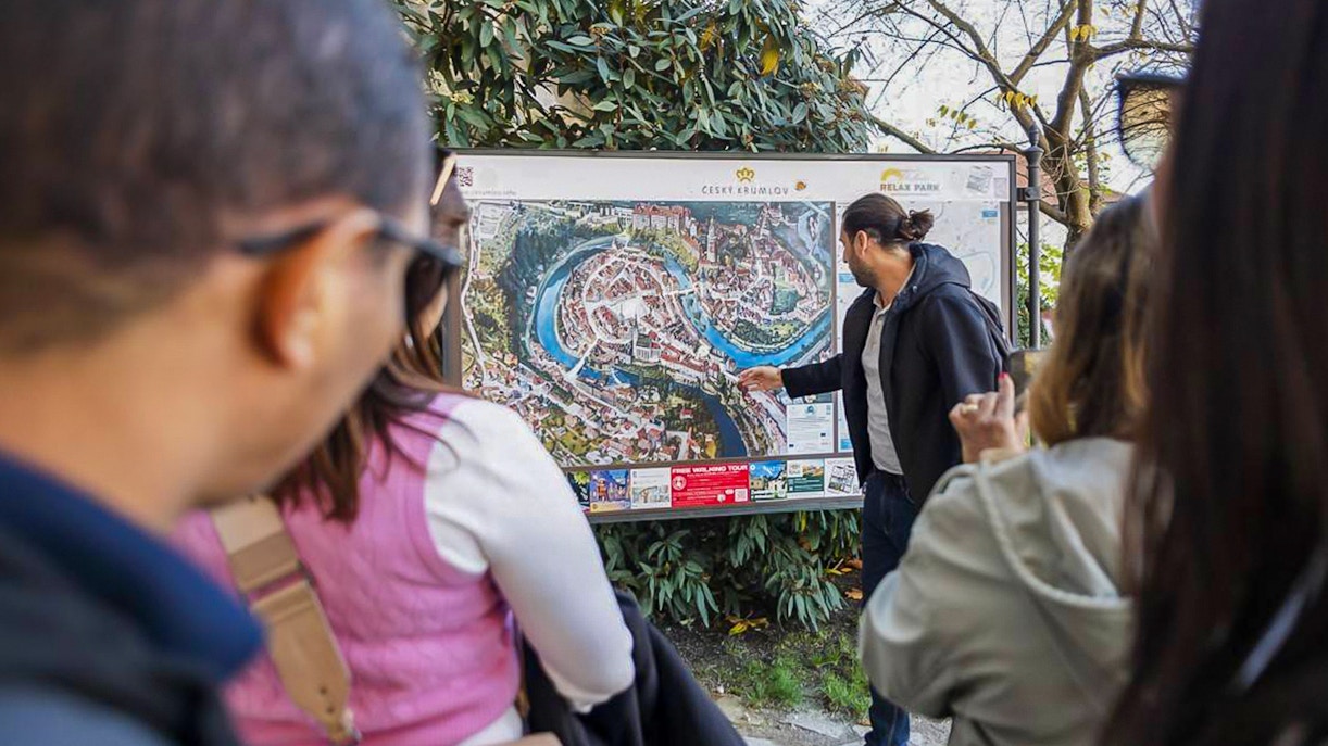 A tour guide giving information to tourists during Full-Day Guided Tour of Cesky Krumlov