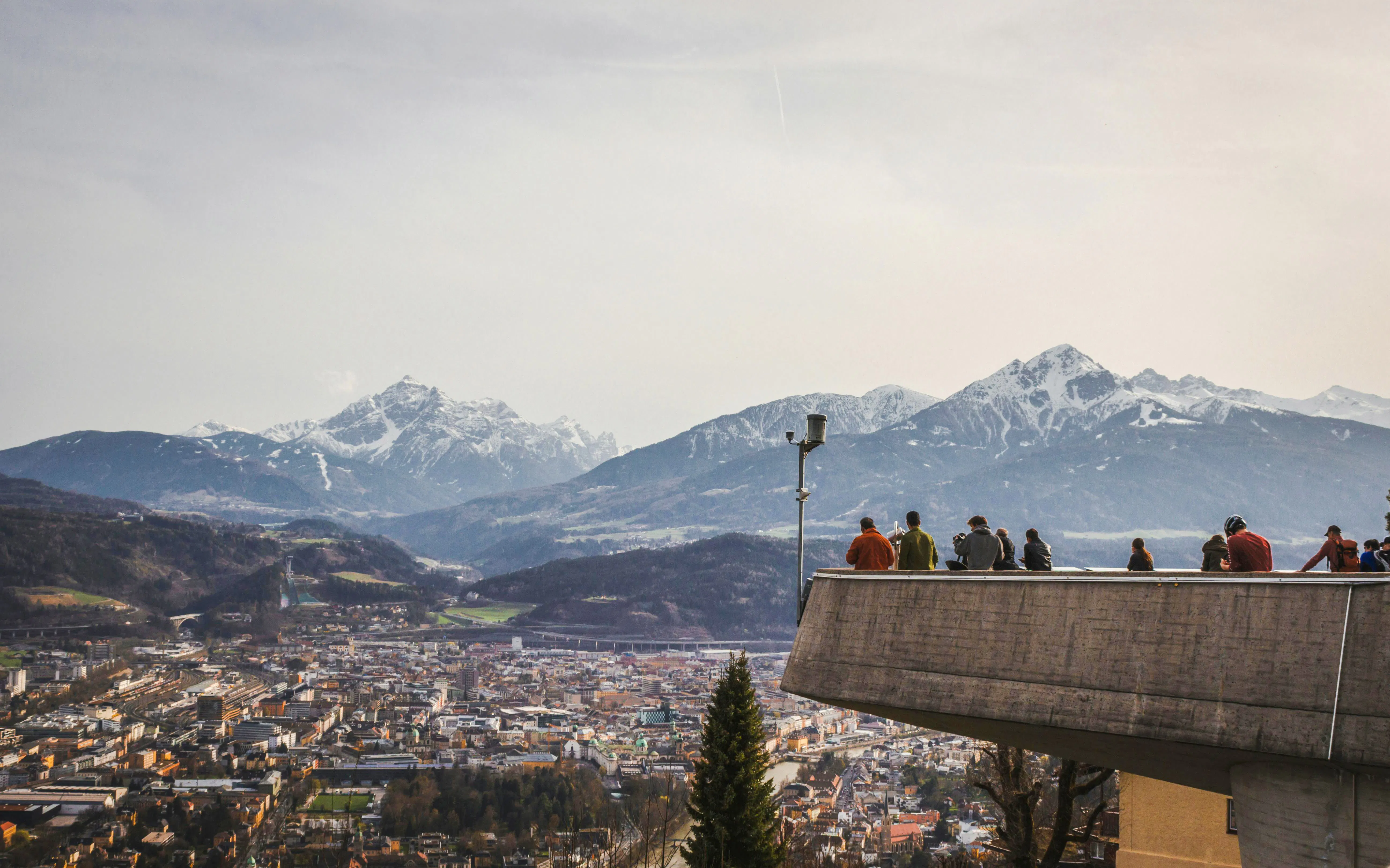 Innsbruck view from Hungerburgstation with people on observation deck, Austria.