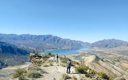 Trekking group at Cerro Bayo, Argentina with mountain and lake views.